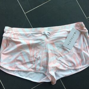 Pink and  White patterned Athleta swim shorts